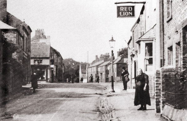 mrs mary godfrey standing outside the red lion along windsor street