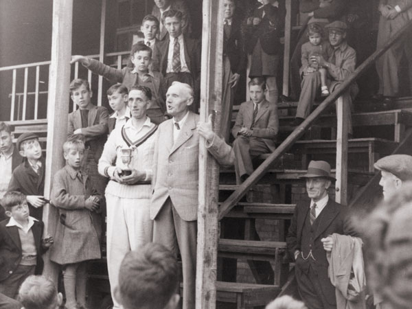 Harold Alsop receiving the winner's trophy in 1945 at Kirkby Road, Barwell.