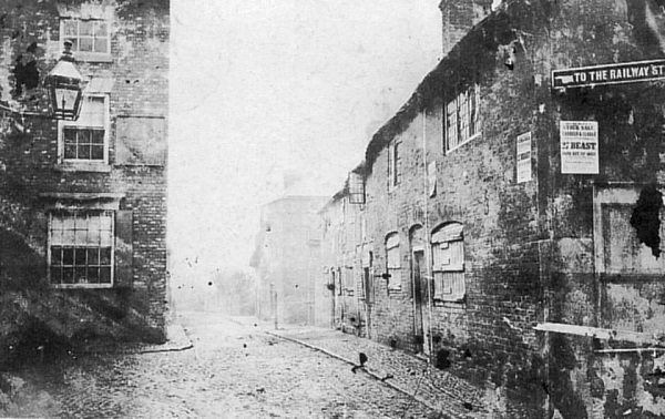 Station Road from the Market Place, about 1872, with the Globe Inn to the left.