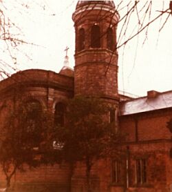 bell tower, apsidal east end and sacristies of 1884-5